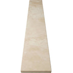 Ivory light travertine saddle threshold with honed beige finish and beveled edges
